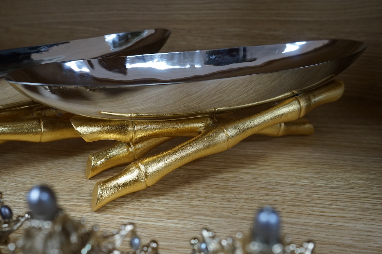 A group of L’objet gilt metal table decorations; twelve decorative ‘Chinese pagoda’ freshwater pearl and Swarovski crystal mounted napkin rings, and two dishes on faux bamboo stands. Condition - good.